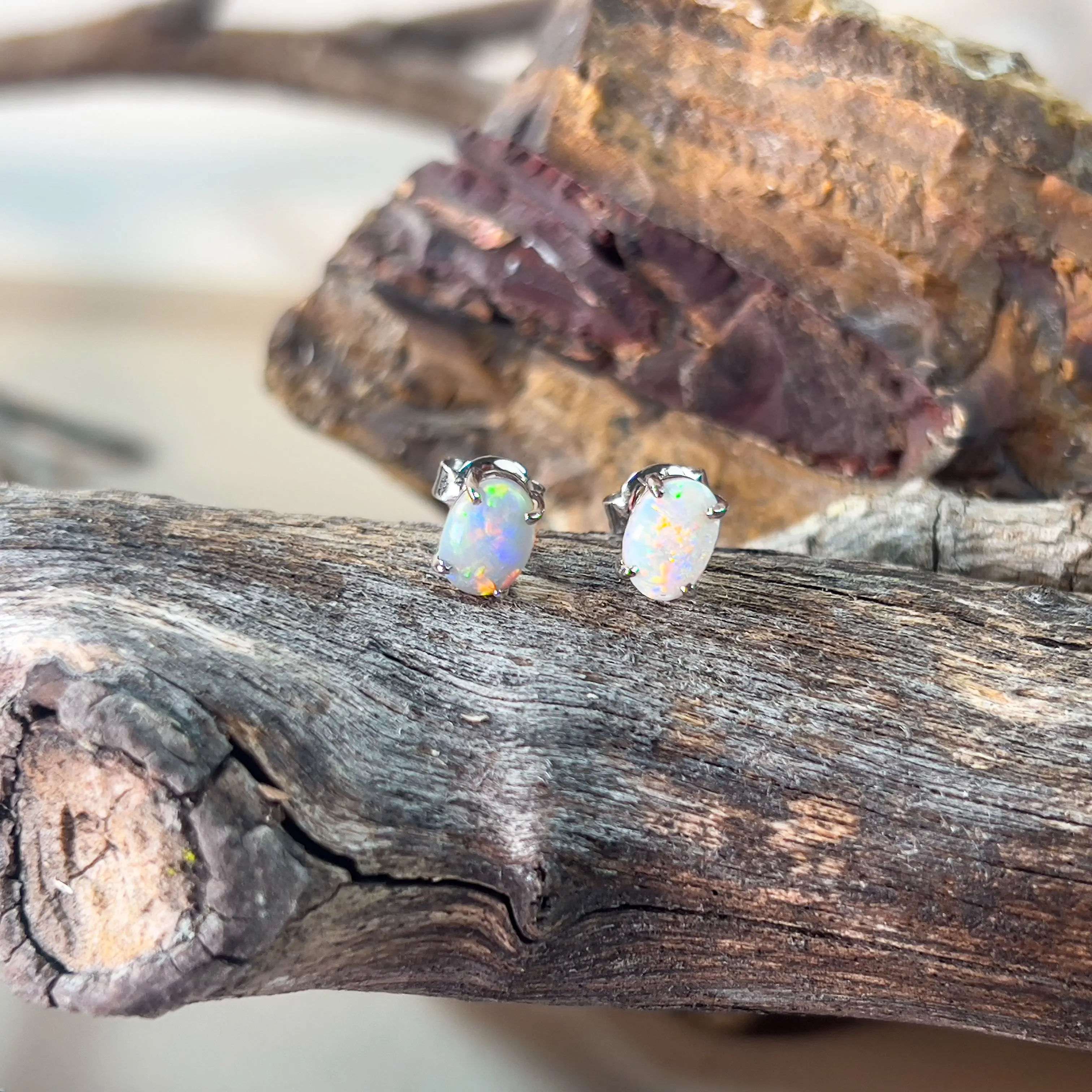 14kt White Gold Black Opal studs Red colours 1.11ct