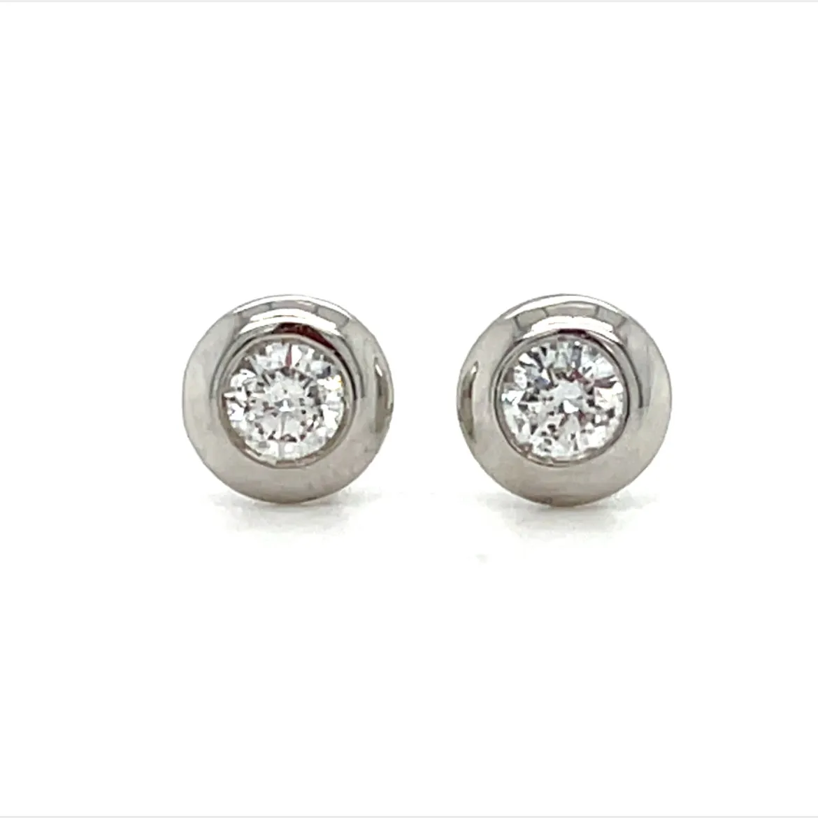 14KW Diamond Solitaire Stud Earrings. .20 CTW