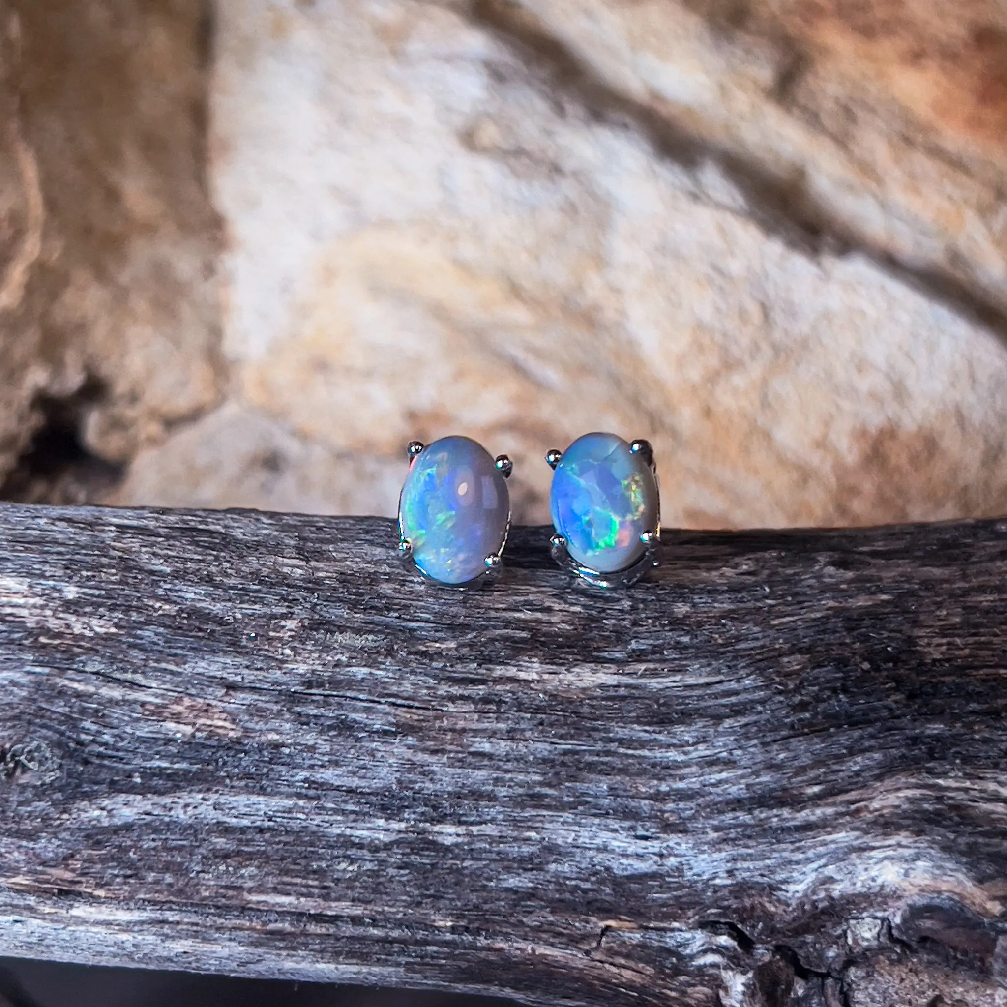 18kt White Gold Black Opal studs 1.2ct claw set