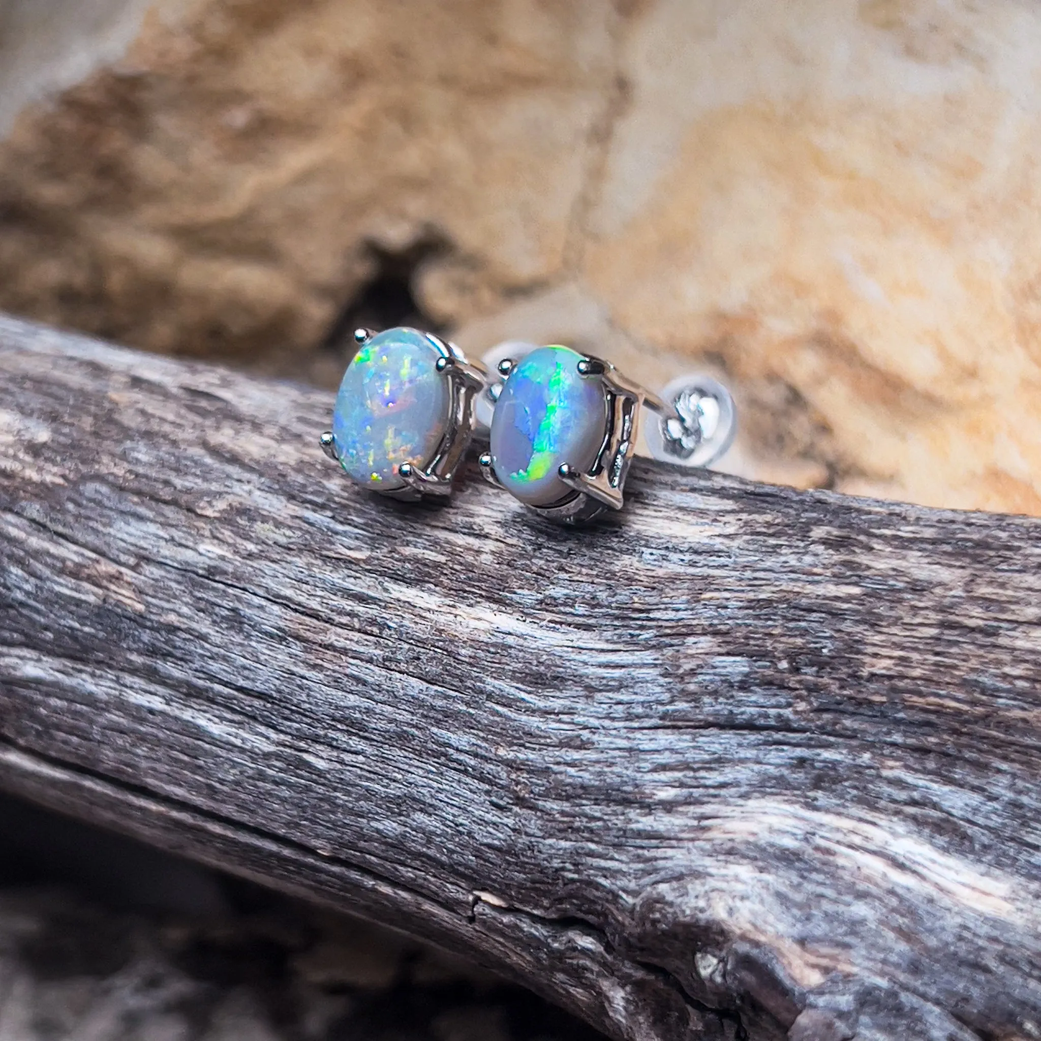 18kt White Gold Black Opal studs 1.2ct claw set