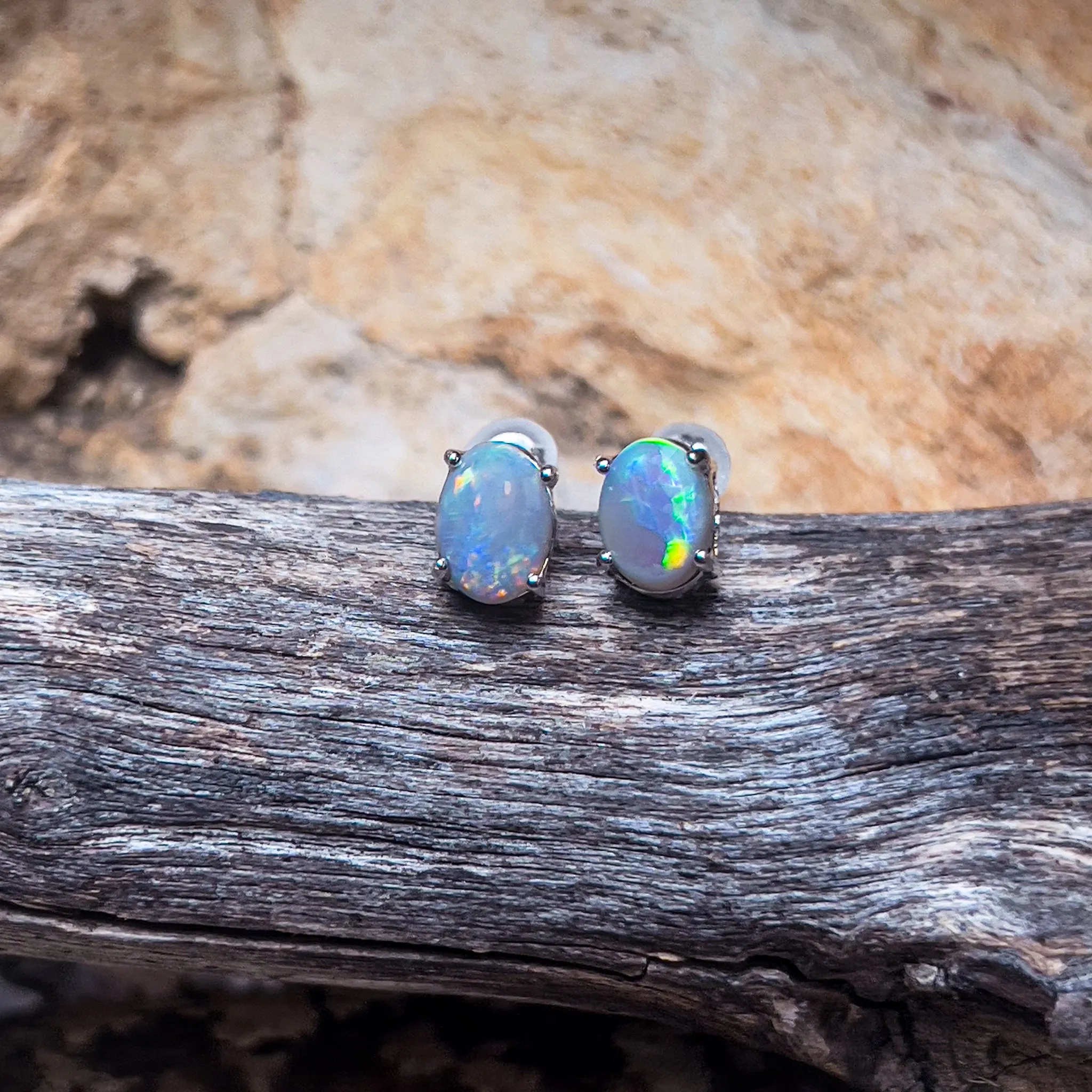 18kt White Gold Black Opal studs 1.2ct claw set