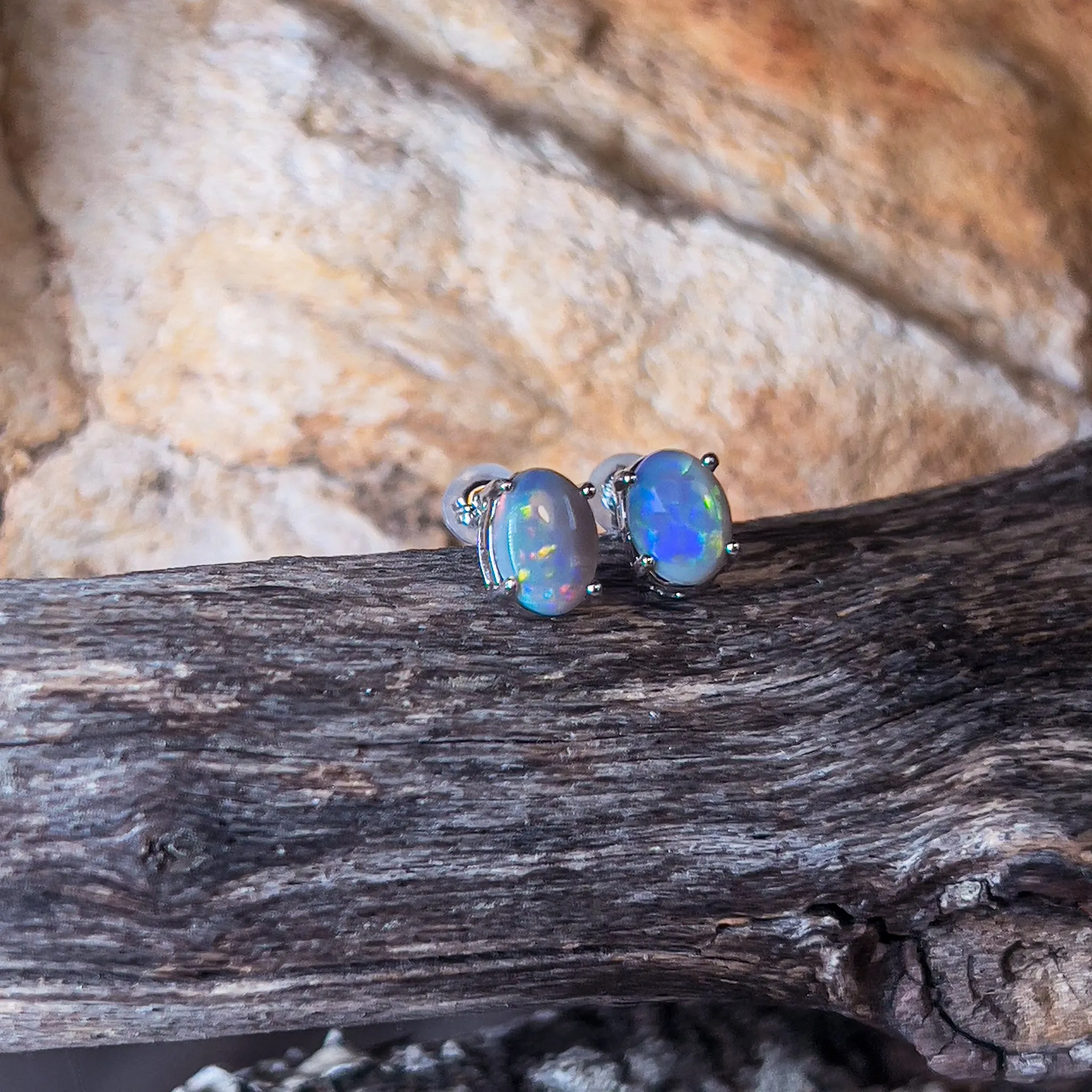 18kt White Gold Black Opal studs 1.2ct claw set