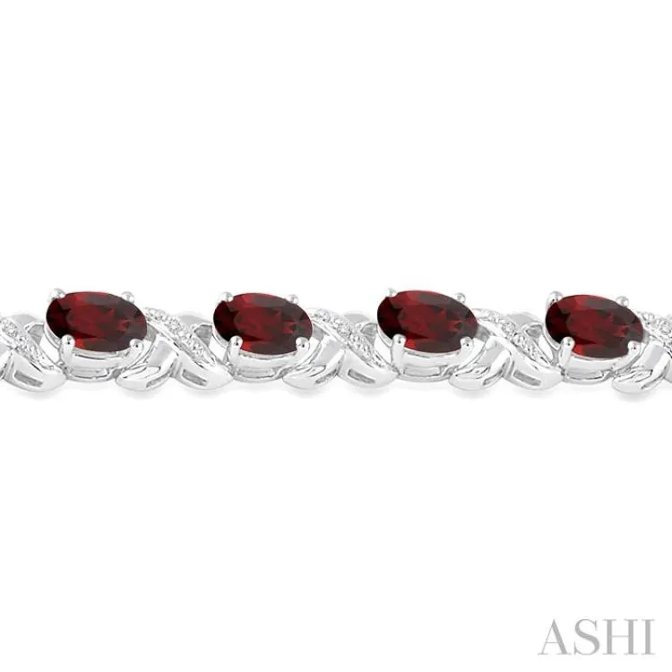 7x5  MM Oval Cut Garnet and 1/20 Ctw Round Cut Diamond Fashion Bracelet in Sterling Silver