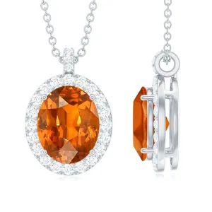 Oval Created Orange Sapphire and Diamond Halo Pendant